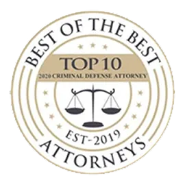 Circular gold and white emblem with scales of justice and text recognizing top criminal defense attorneys.