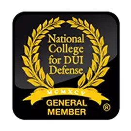 Logo of the National College for DUI Defense with gold laurel wreath on black background.