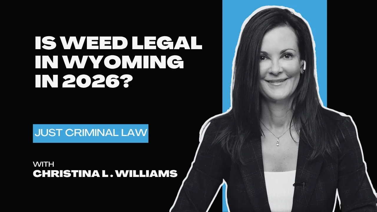 Professional woman in black blazer beside text asking about weed legality in Wyoming in 2026.