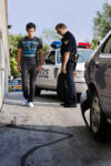 Police officer giving a man a field sobriety test