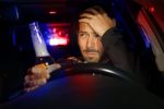 Drunk man driving car. Police stopped driver under alcohol influence